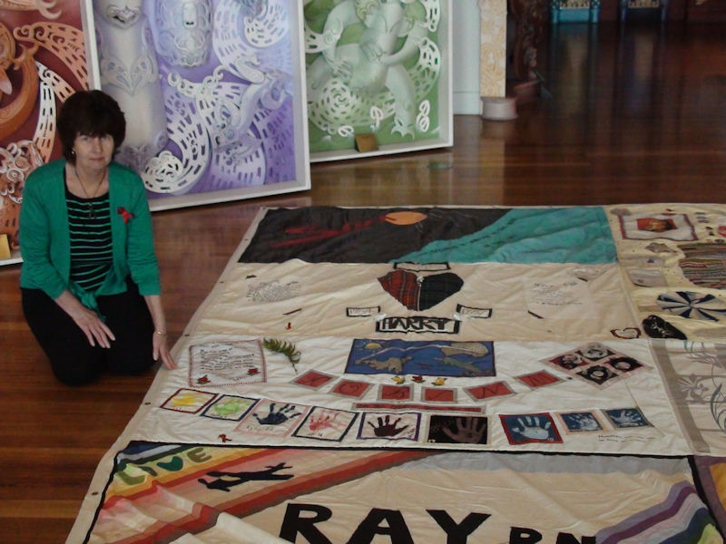 Another view of Nicki with the panel she made for Robin while it was on display at Te Papa on the day The Quilt was formally welcomed to Te Papa, its new home.