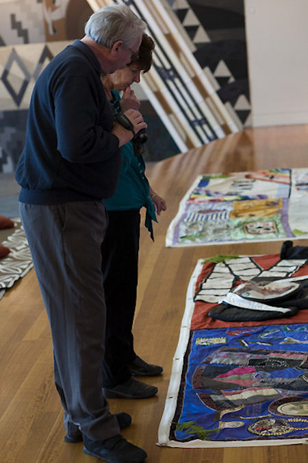 Kevin Jensen and Nicki Eddy share memories of one of the panels on display at Te Papa.